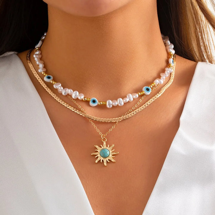 Conjunto de Colares em Camadas Parel & Olho Maligno – Pendente Sol Boho