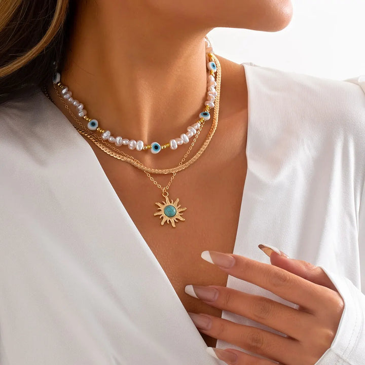 Conjunto de Colares em Camadas Parel & Olho Maligno – Pendente Sol Boho