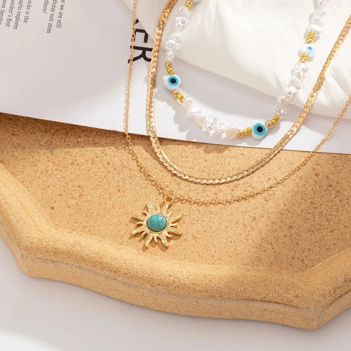Conjunto de Colares em Camadas Parel & Olho Maligno – Pendente Sol Boho