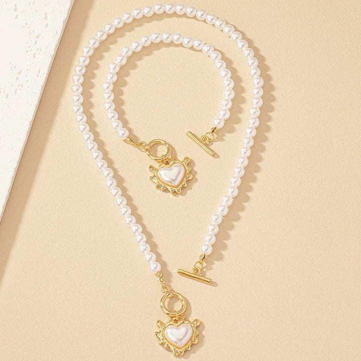 Conjunto de pulseira e colar com pendente em forma de coração em pérolas de 2 peças