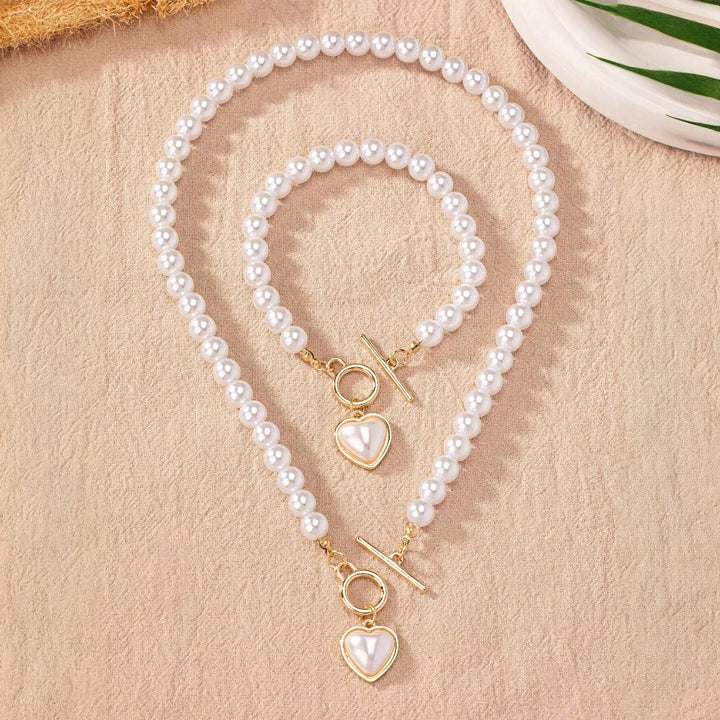 Conjunto de pulseira e colar com pendente em forma de coração em pérolas de 2 peças