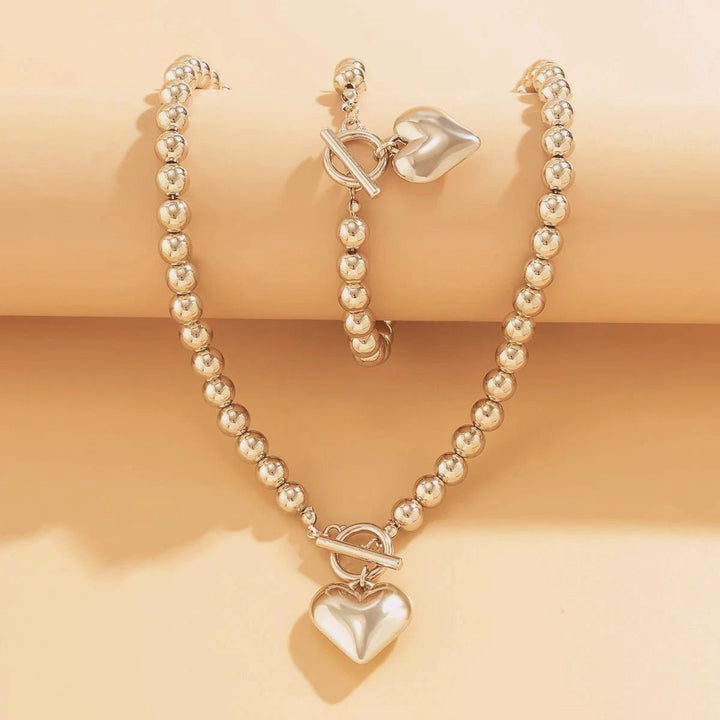 Conjunto de pulseira e colar com pendente em forma de coração em pérolas de 2 peças