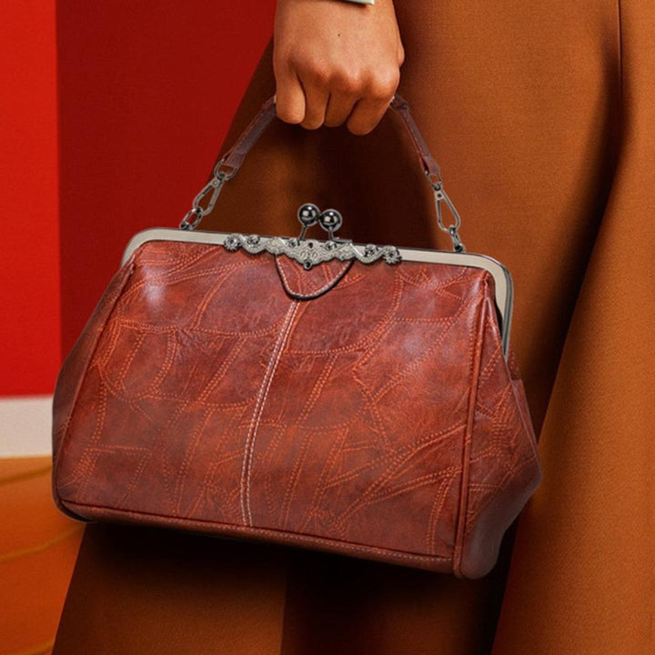 Bolso vintage com fecho a pressão